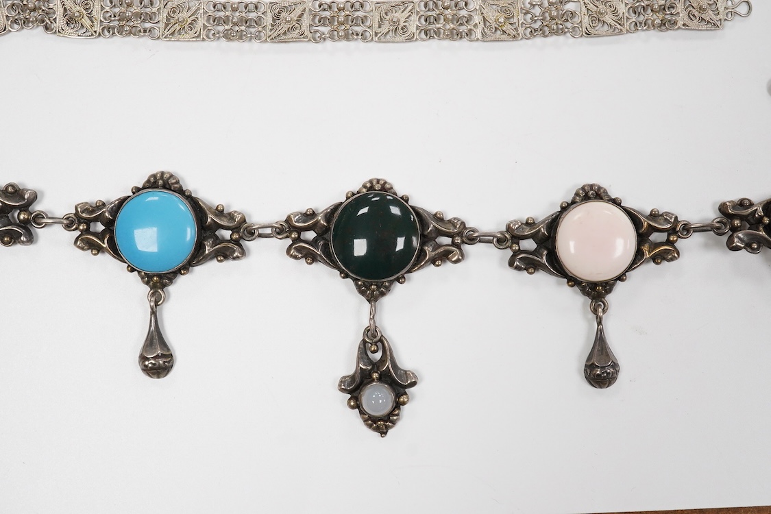 A collection of assorted jewellery including a stylish textured 925 necklace, 76cm and a similar bracelet, 18cm, a Portuguese white metal hinged bracelet, a white metal necklace with amberoid pendant, a white metal and g